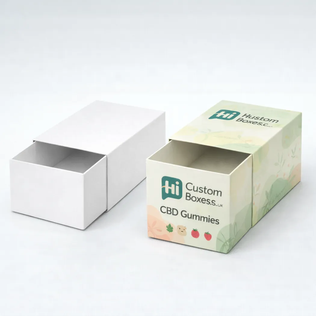 Two upright boxes with wave designs and a circular window showing colourful gummies inside for display- class=